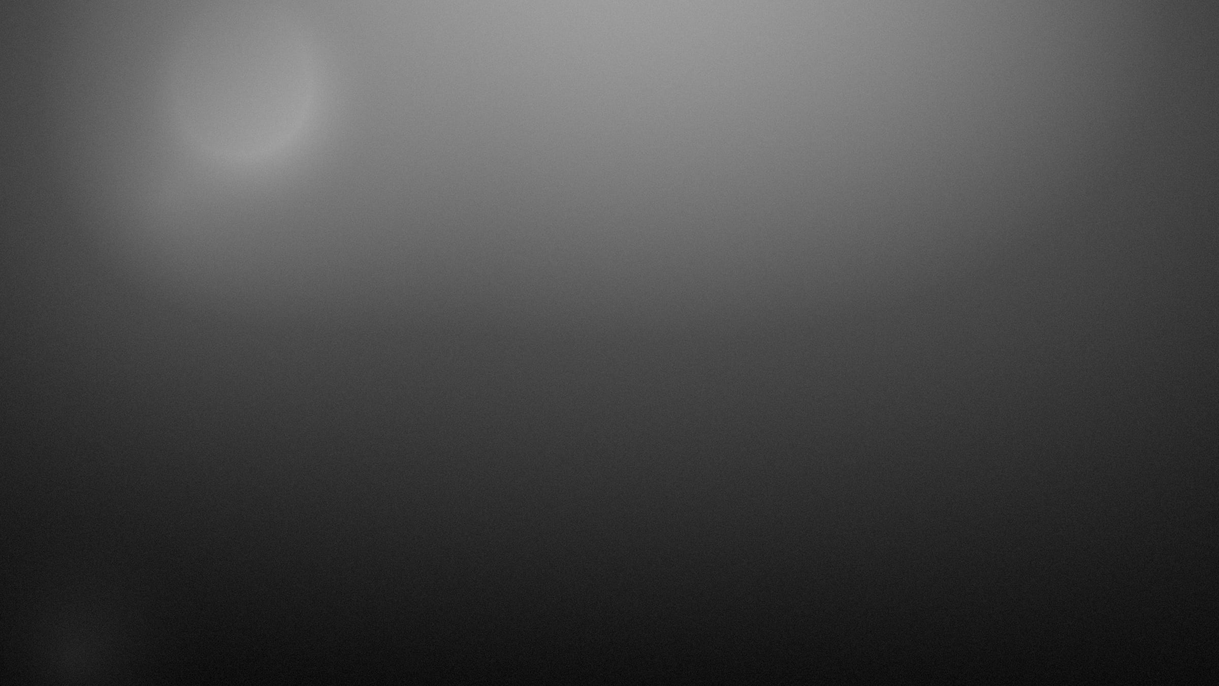 Crowd silhouetted against stage light